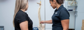 Physiotherapist providing posture analysis advice